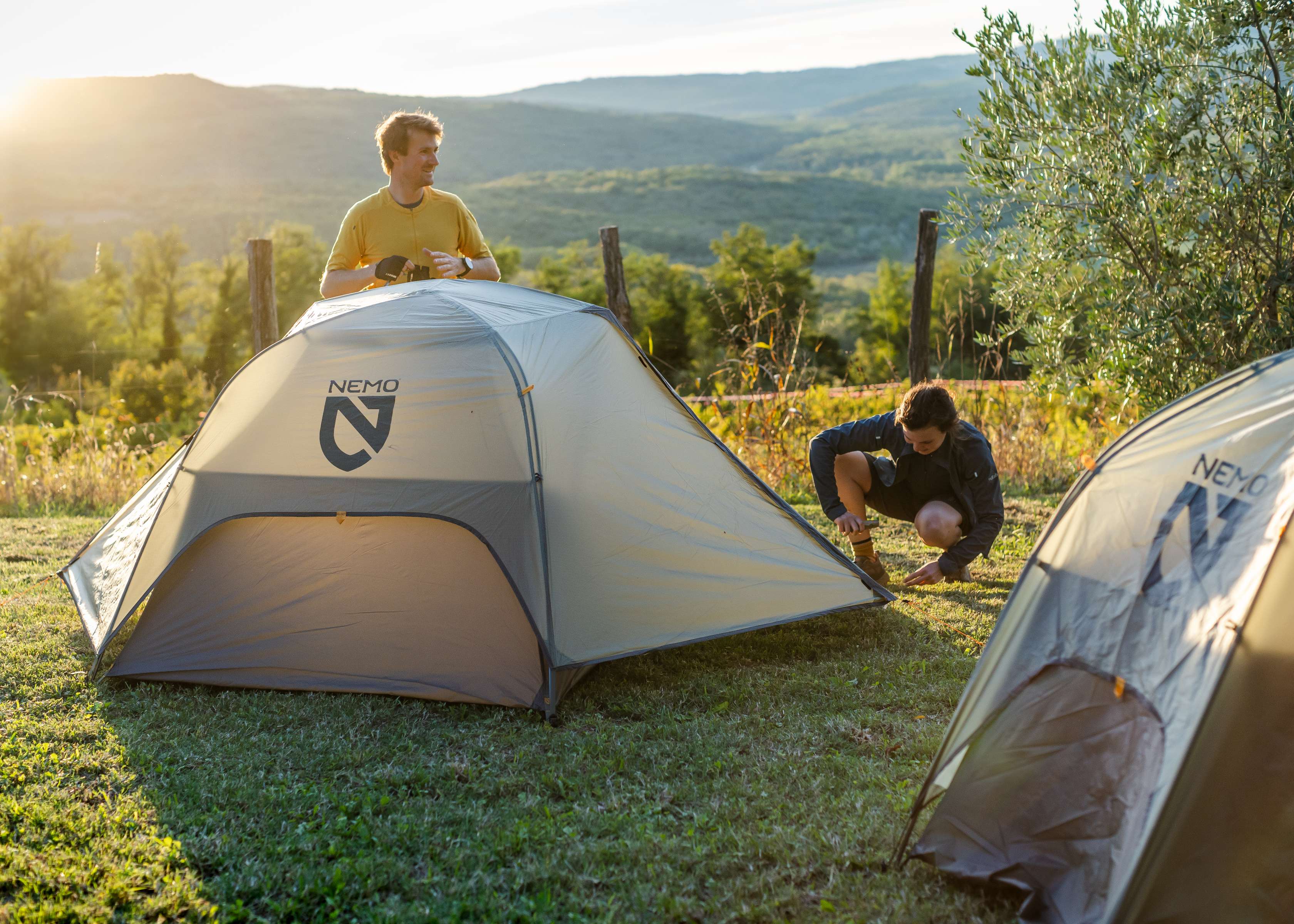 A person pitching a Nemo tent 