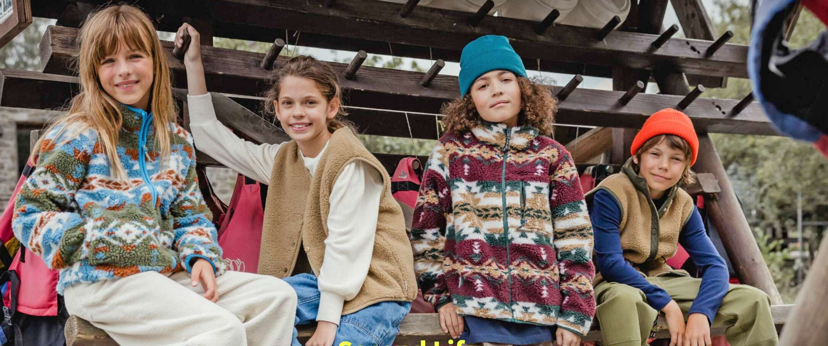 Four kids wearing Ayacucho fleeces 