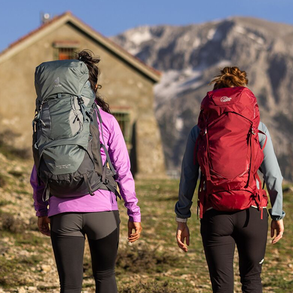 Two backpackers with theit heavy rucksacks