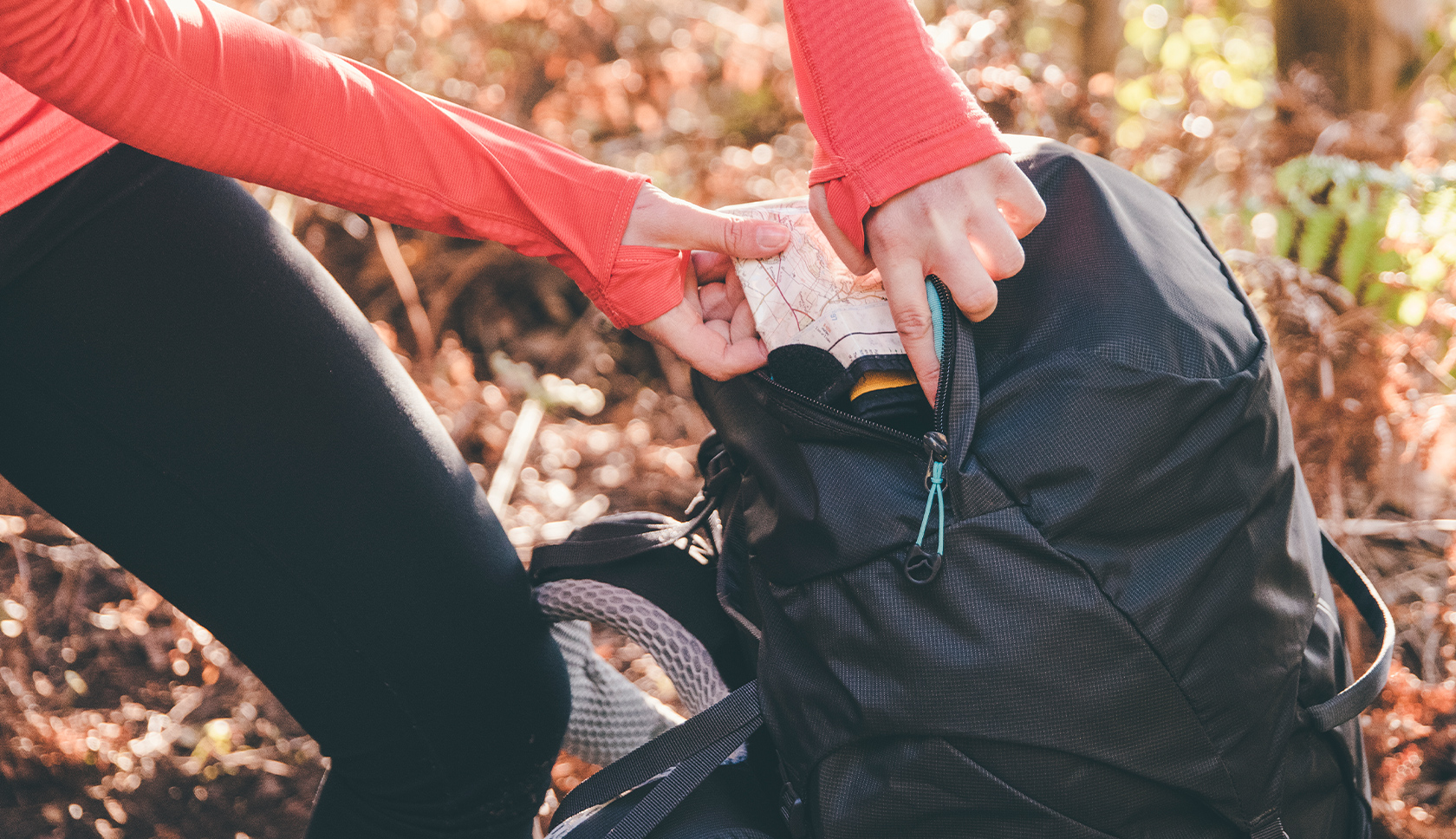 woman organising her rucksack