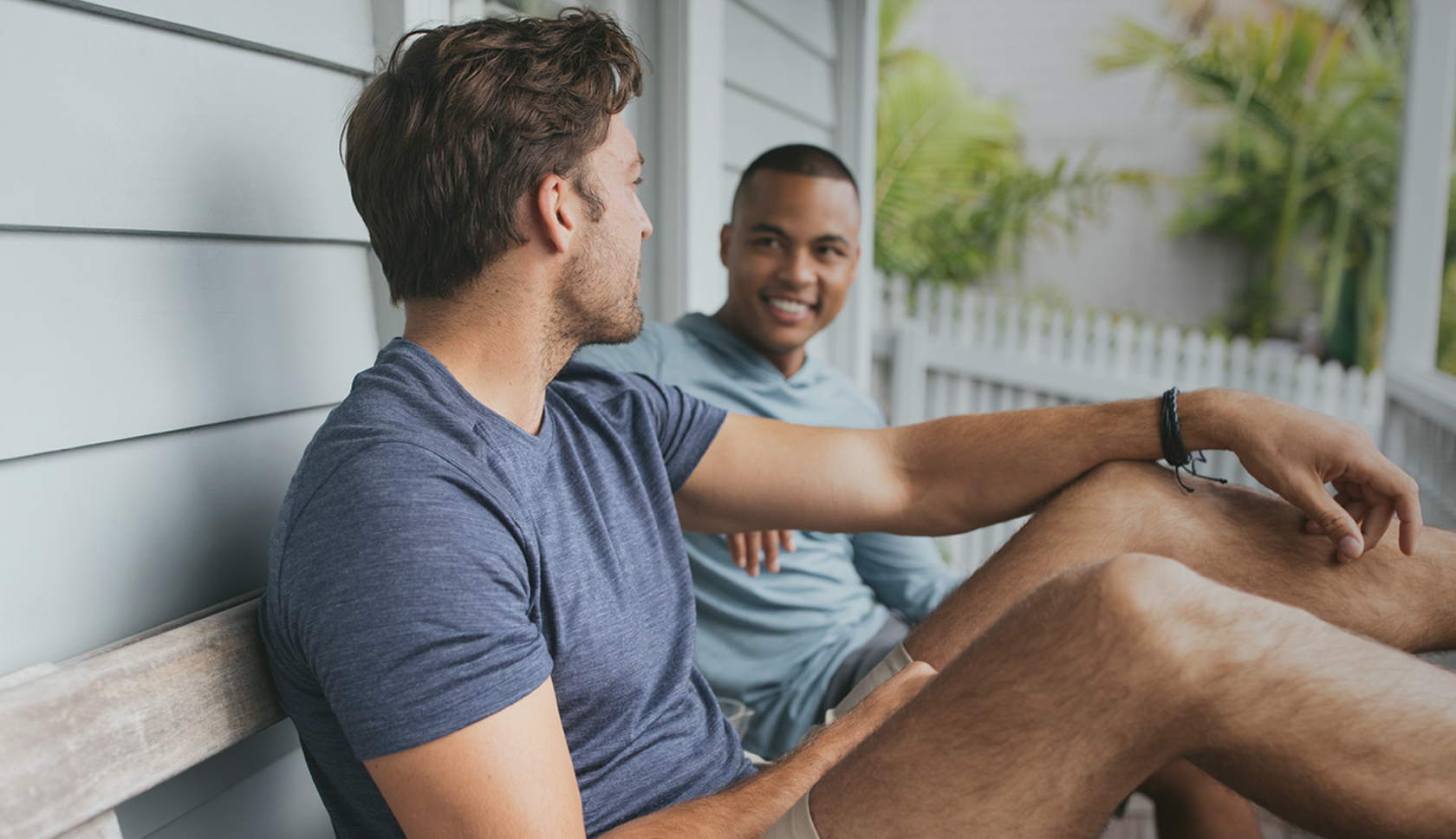 A woman wearing a Mountain Equipment jacket and helmet climbing