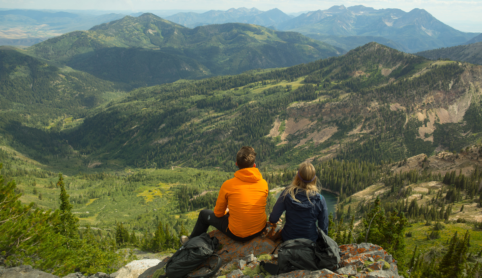 Woman wearing a Rab red jacket