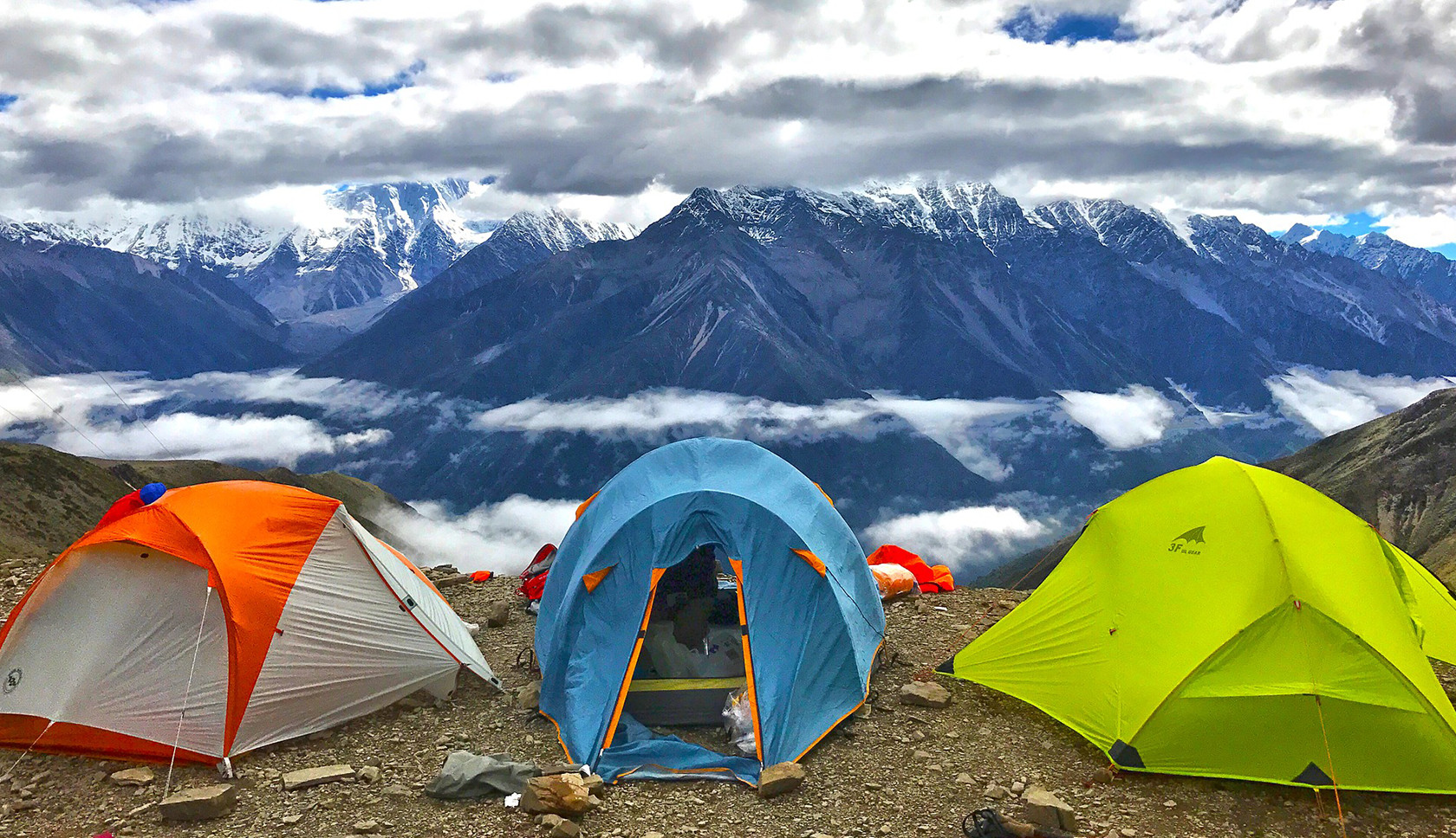 A camp stove boiling a pan of water 