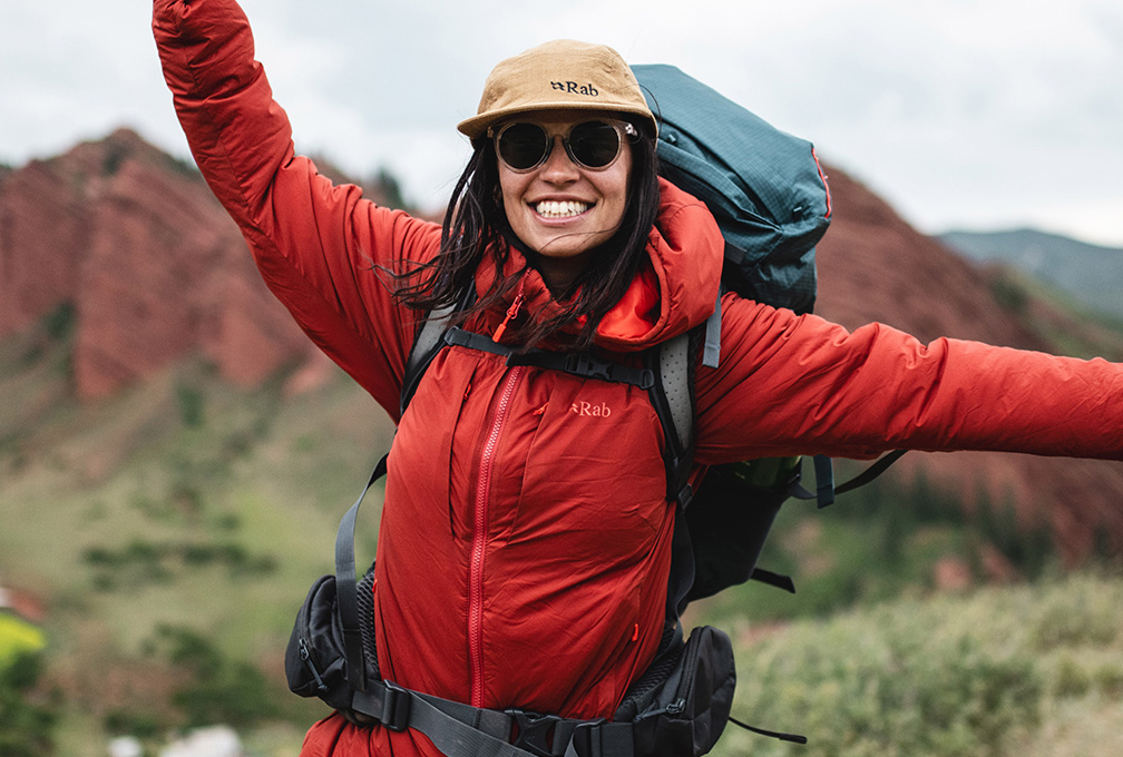 Woman wearing a Rab red jacket
