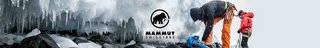 People running through a cave wearing mammut