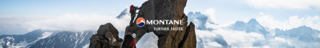 Woman sitting on a rock and looking over a rock valley, wearing Montane gear