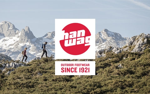 Two people wearing Hanwag boots walking over mountains