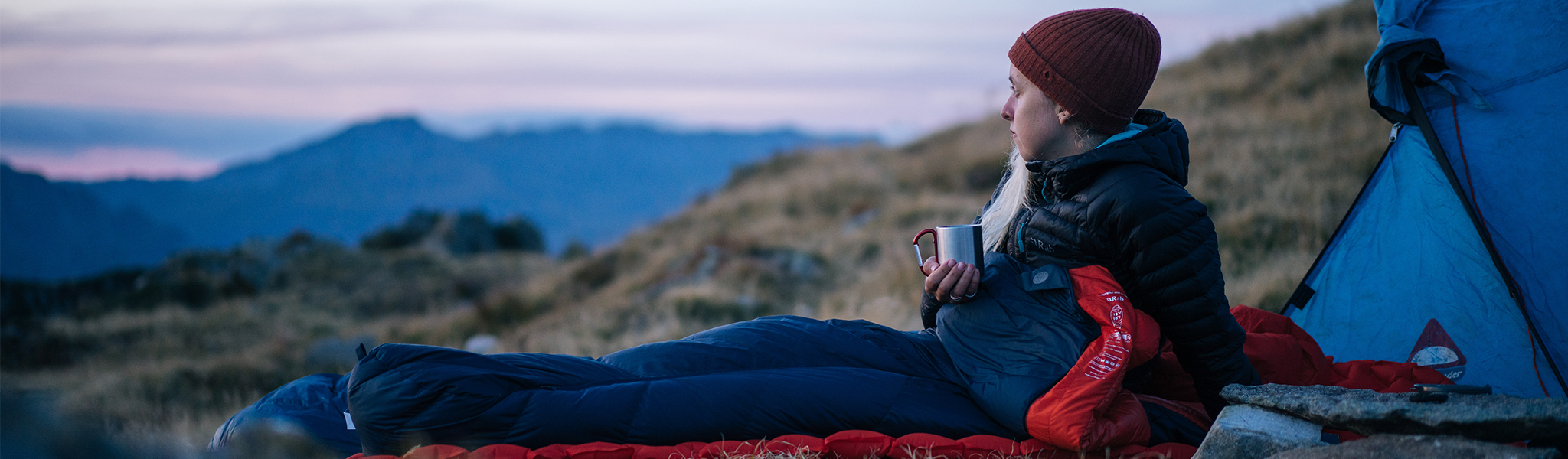 A person on a camping trip on a sleeping mat