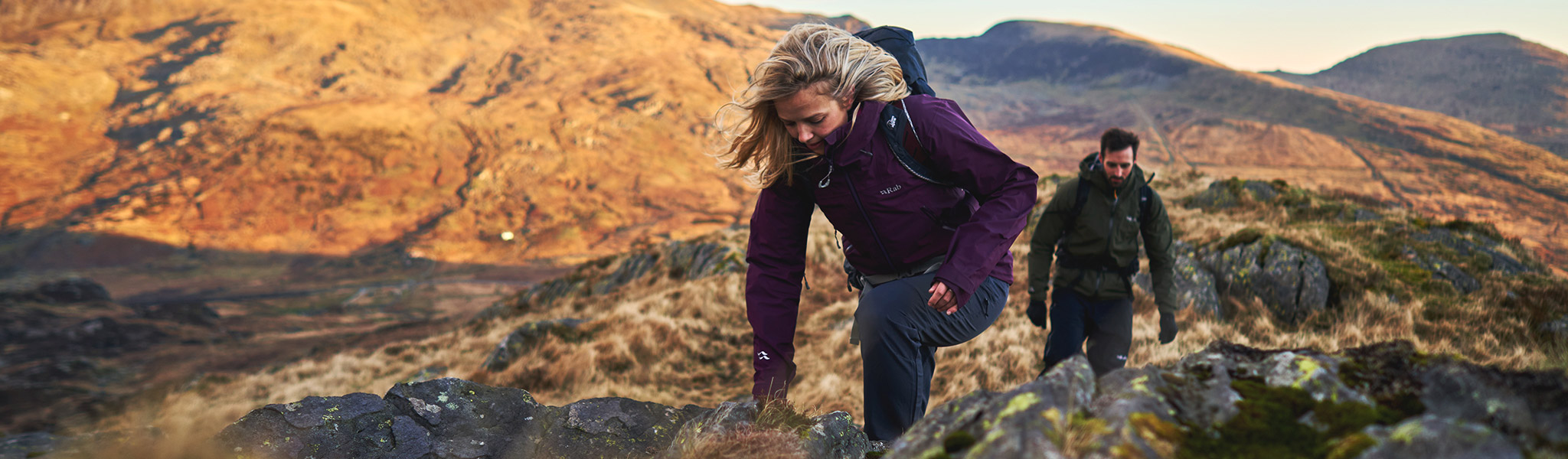 Climber wearing purple Rab jacket
