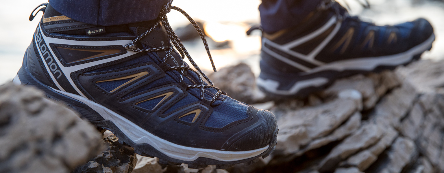 A person wearing Salomon X Ultra walking shoes 