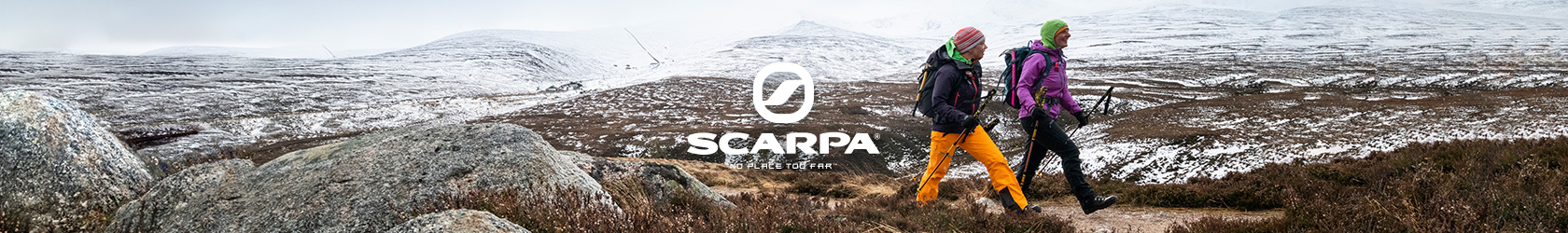 People walking over snowy fields in Scarpa boots