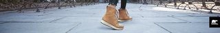 Women's feet in Sorel boots with their logo in the right bottom corner