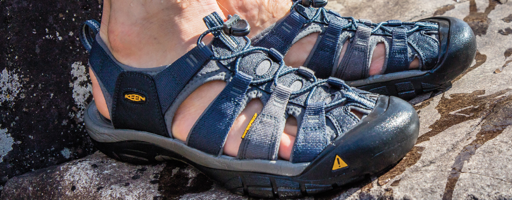 An image of a man wearing Keen sandals 