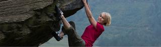Women Climbing Rock