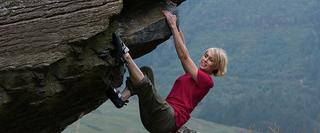 Women Climbing Rockface