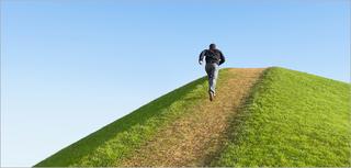 man running up hill