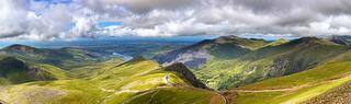 Green hills and mountains with footpaths