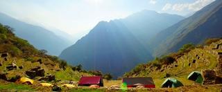 Group of tents facing the mountains