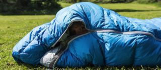 woman snuggled in sleeping bag