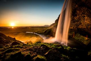 Golden Sunset across a waterfall in Iceland