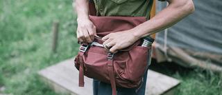 Man buckles his Millican Maverick Collection