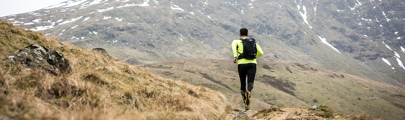 A man running through the hills 