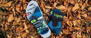 A package of socks on some autumnal leaves