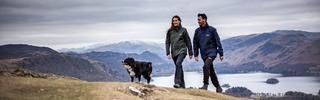 Couple walking their dog in the lake district