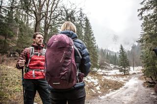 Man & Woman walking through forest