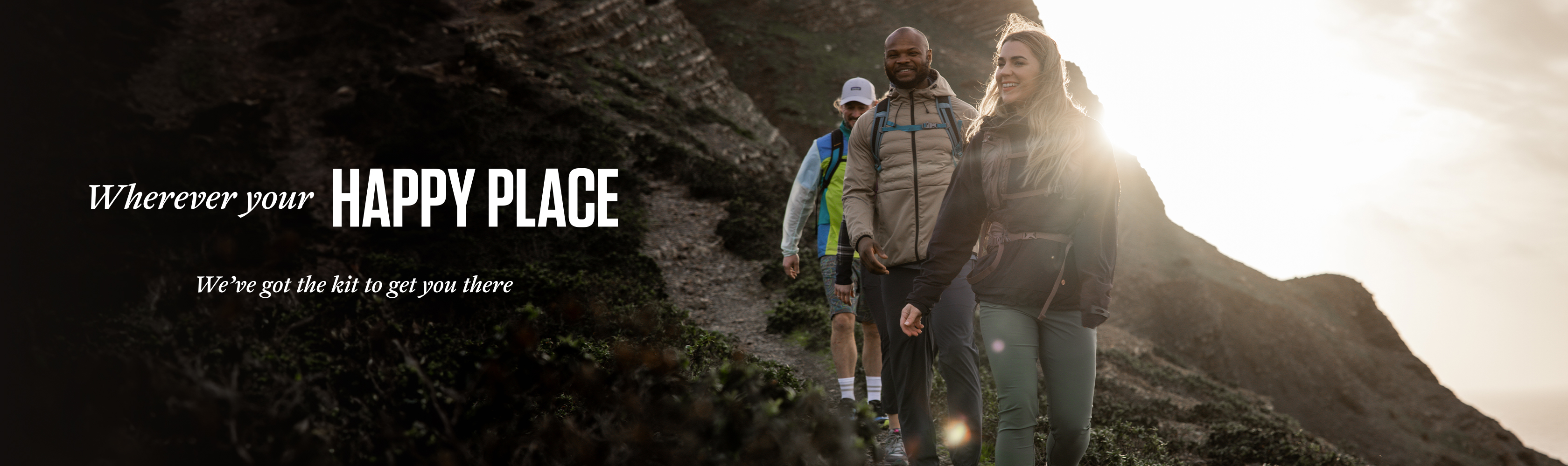 People walking together with the words 'Wherever your happy place, we've got the kit to get you there'