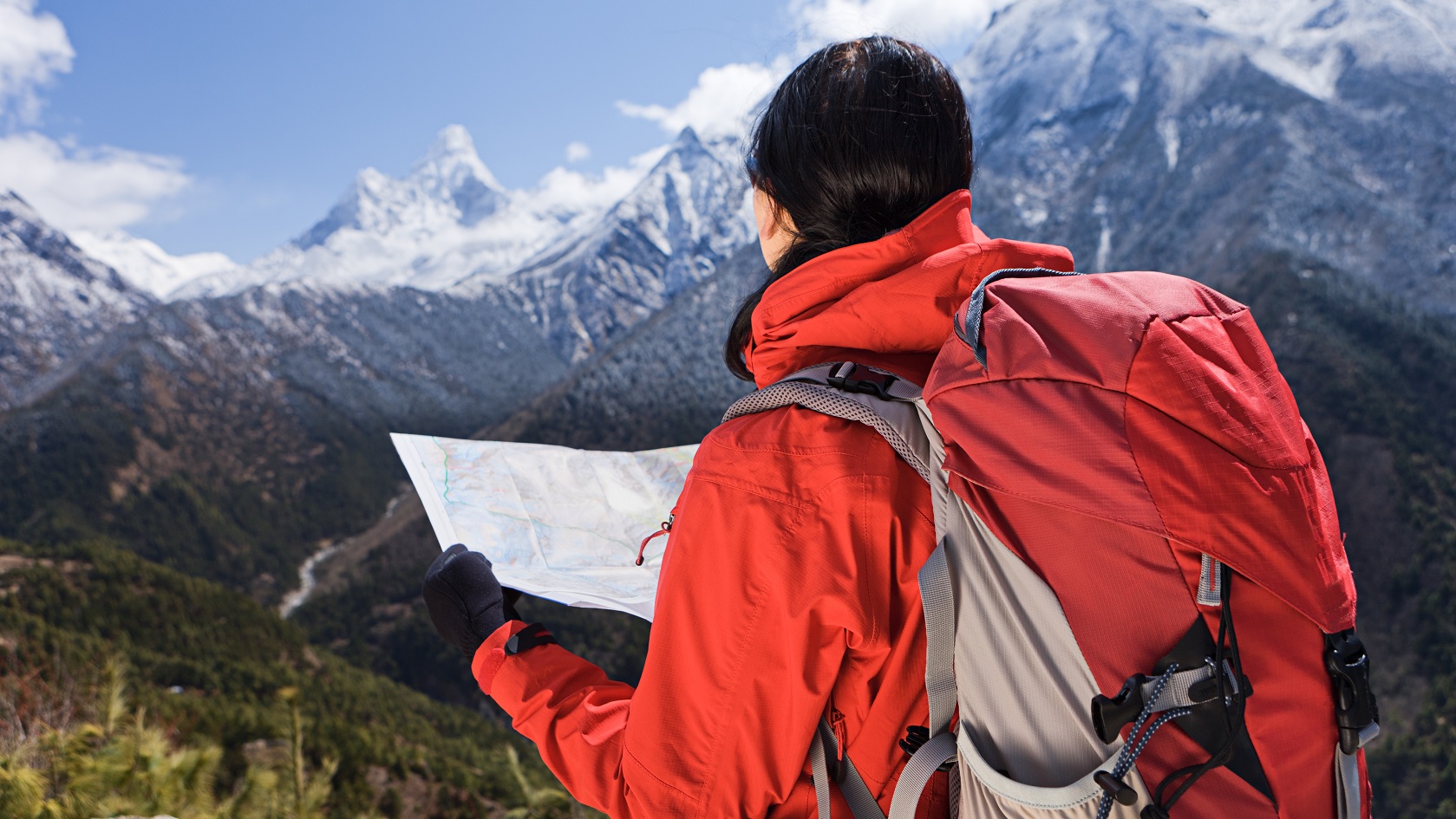 Woman looking at the map in Himalayas. Mount Everest National Park. This is the highest national park in the world, with the entire park located above 3,000 m ( 9,700 ft). This park includes three peaks higher than 8,000 m, including Mt Everest. Therefore, most of the park area is very rugged and steep, with its terrain cut by deep rivers and glaciers. Unlike other parks in the plain areas, this park can be divided into four climate zones because of the rising altitude. The climatic zones include a forested lower zone, a zone of alpine scrub, the upper alpine zone which includes upper limit of vegetation growth, and the Arctic zone where no plants can grow. The types of plants and animals that are found in the park depend on the altitude.http://bem.2be.pl/IS/nepal_380.jpg