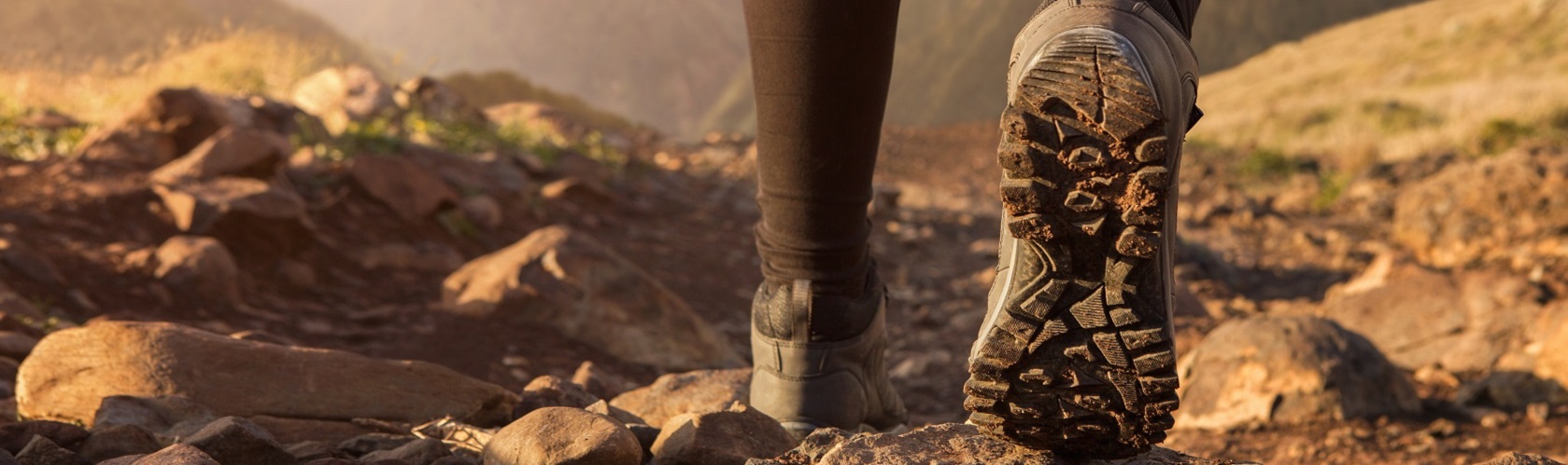 A person on a walk in their hiking boots 
