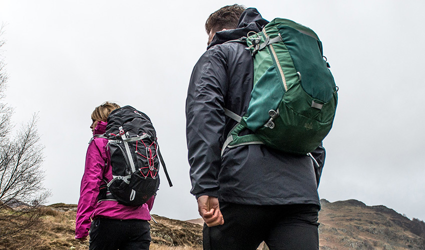 Couple hiking with their rucksacks