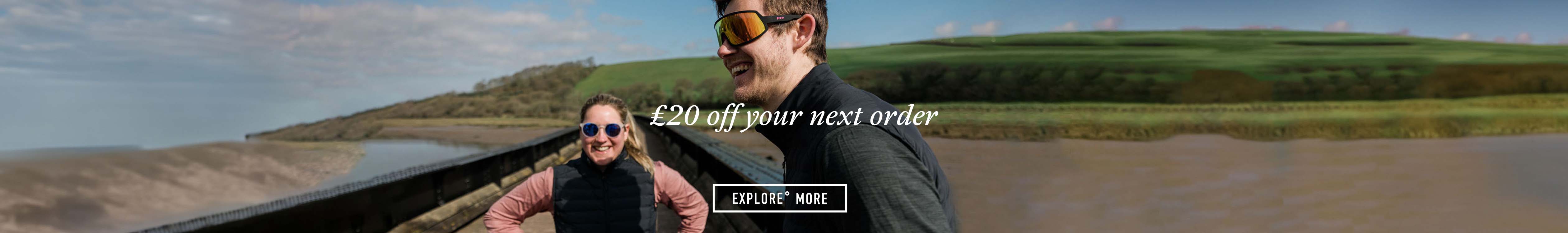 £20 off your next order - Two people are smiling, wearing sunglasses, outdoors
