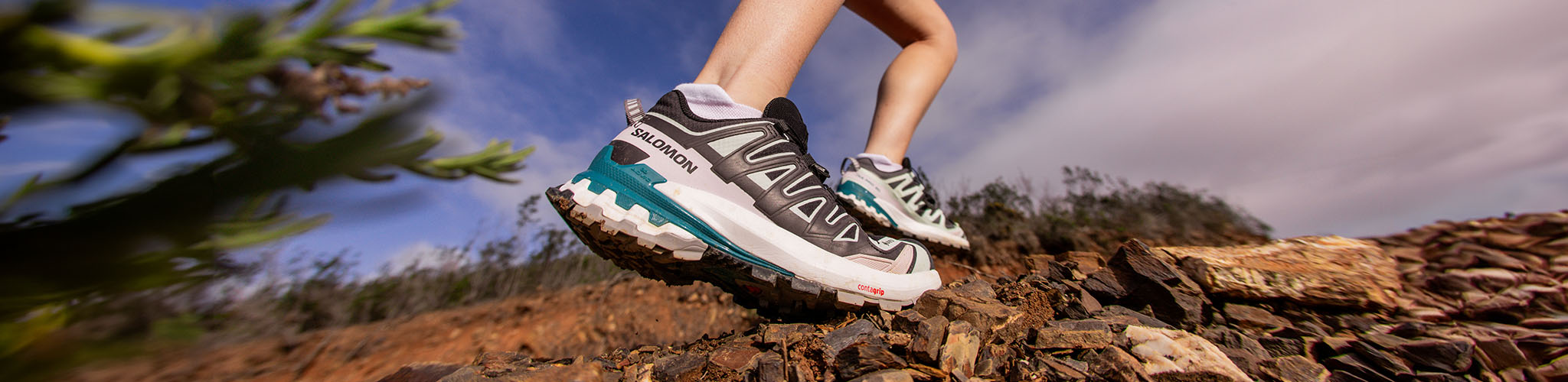 Person running outdoors focus on footwear