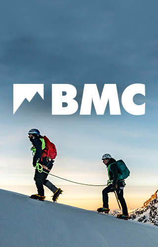 The BMC- person walking on top of mountain