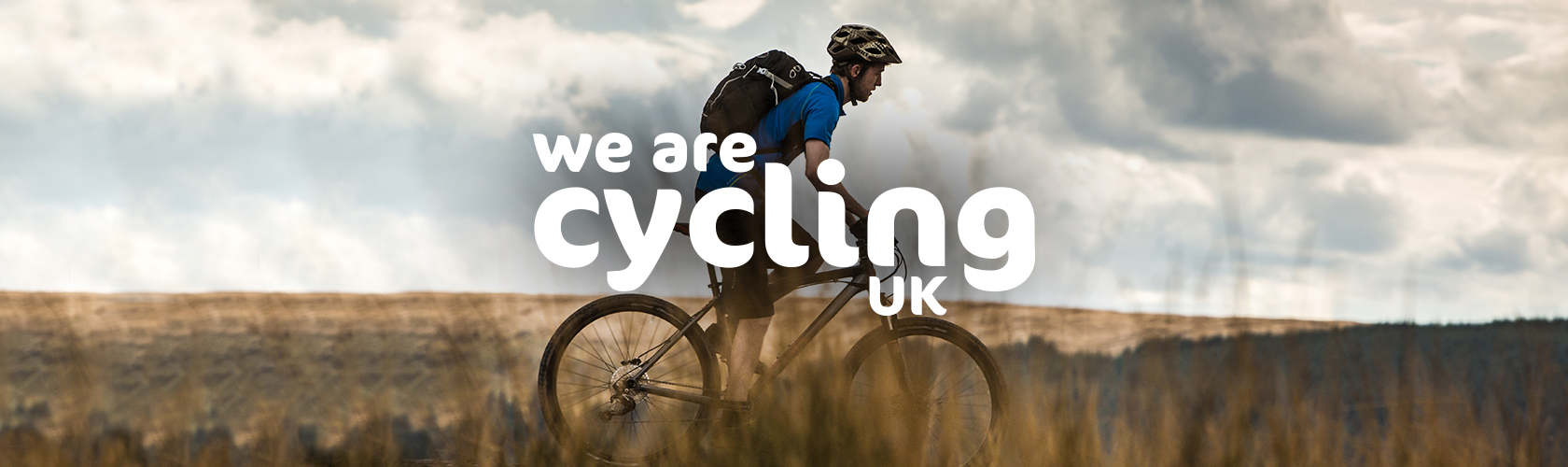 Man Cycling Through Countryside