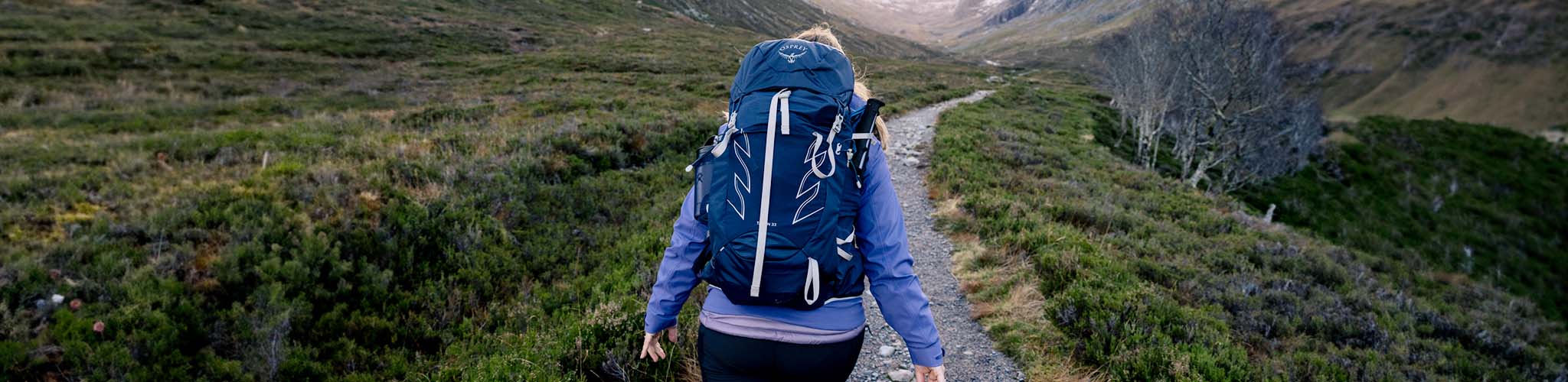 Shop Rucksacks. A person on a hike with their rucksack. 