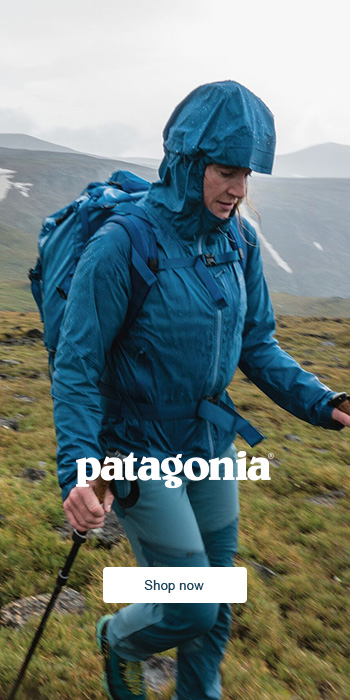 Woman walking in the mountains with Patagonia gear