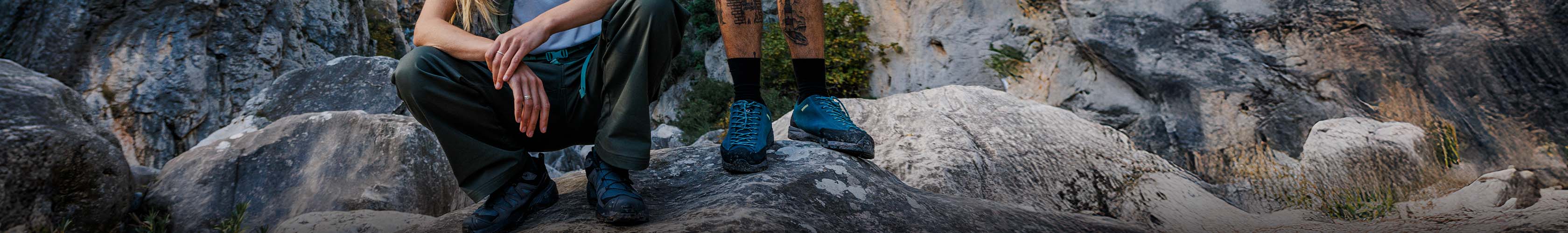 New season walking shoes on rocks at the beach