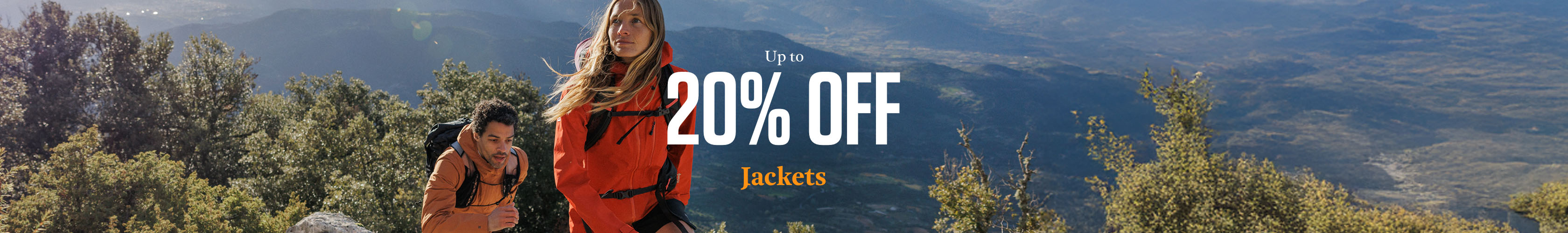 Jackets Offer. Woman and man on top of a mountain at sunrise