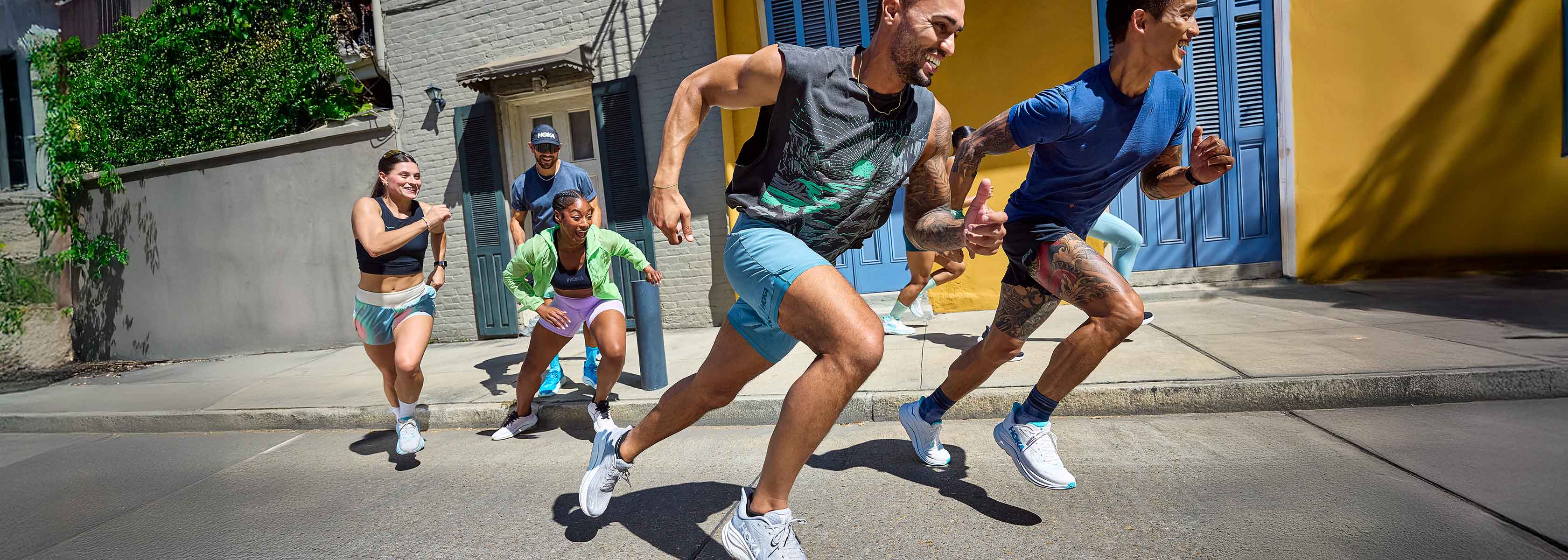 Shop Hoka Clifton. A group of runners on the street