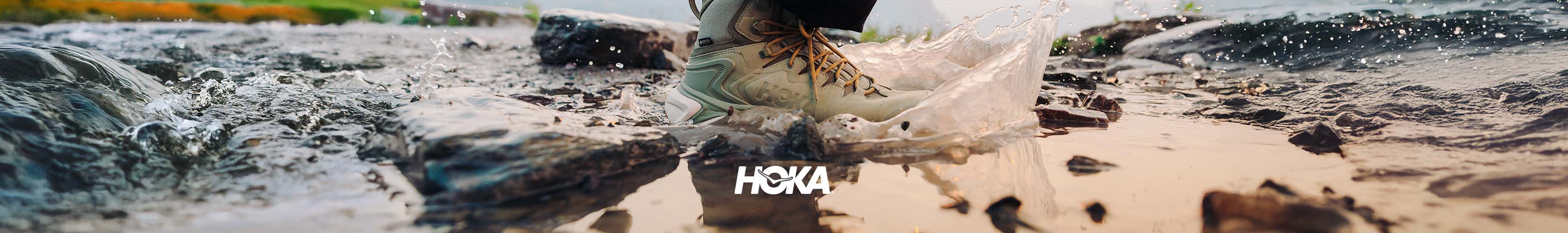 hoka trainer in puddle of water