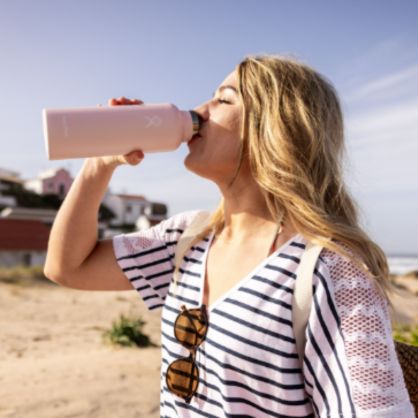 Woman drinking from hydroflask