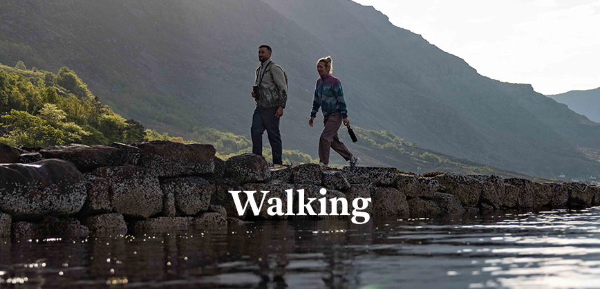 man and a woman walking in the nature