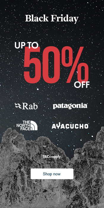 Man sitting in front of a christmas tree