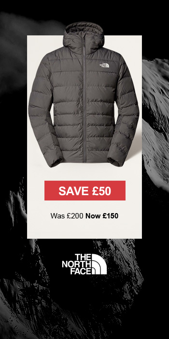 Man sitting in front of a christmas tree