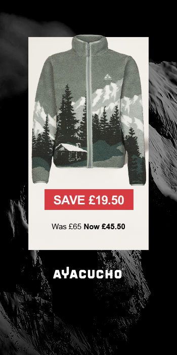 Man sitting in front of a christmas tree