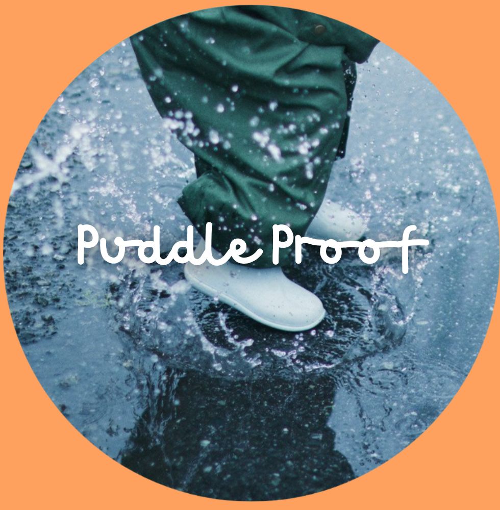 Puddle Proof Waterproofs. Child puddle splashing.