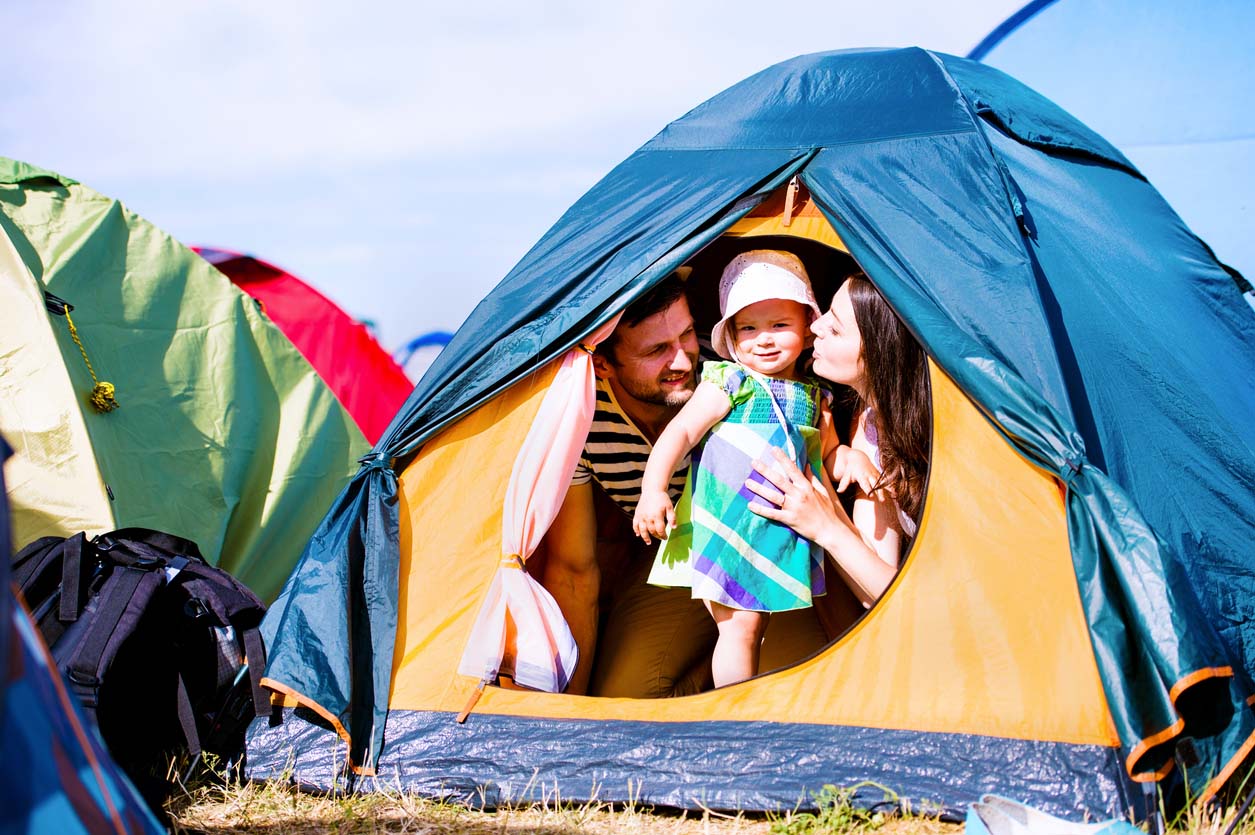 An image of a family in a tent at the Latitude festival campsite